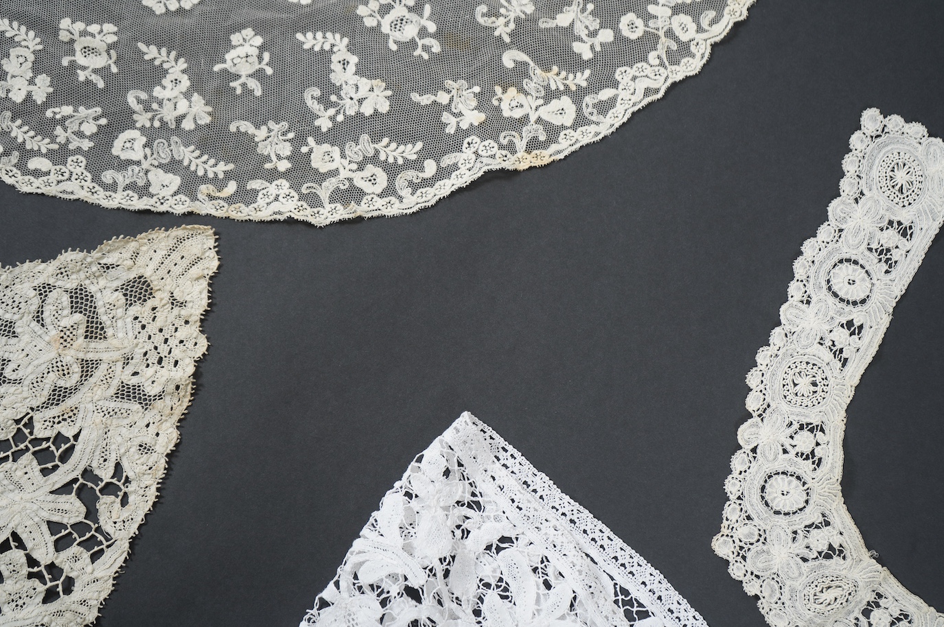Seven late 19th century collars and trimming, being a long wide length of bobbin lace trimming - 268cm, two similar Bruges cream lace collars, an Irish Carrick-ma-cross collar, a fine needle run collar and another with a